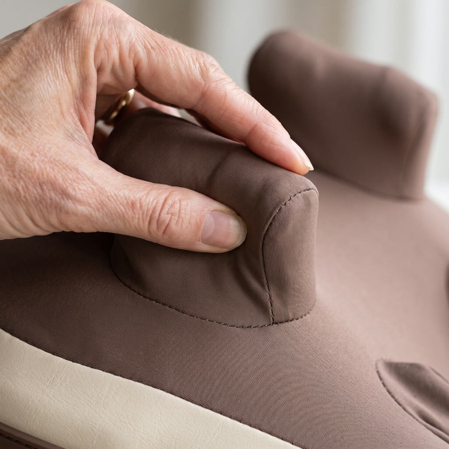 Hand pressing one of HiZoo's soft kneading nodes