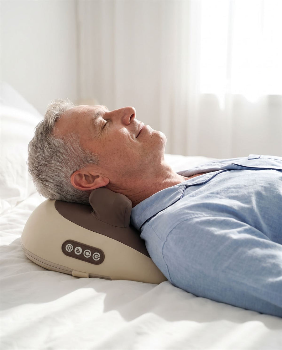 Man in his 60s lying back on Hizoo in bed in the morning